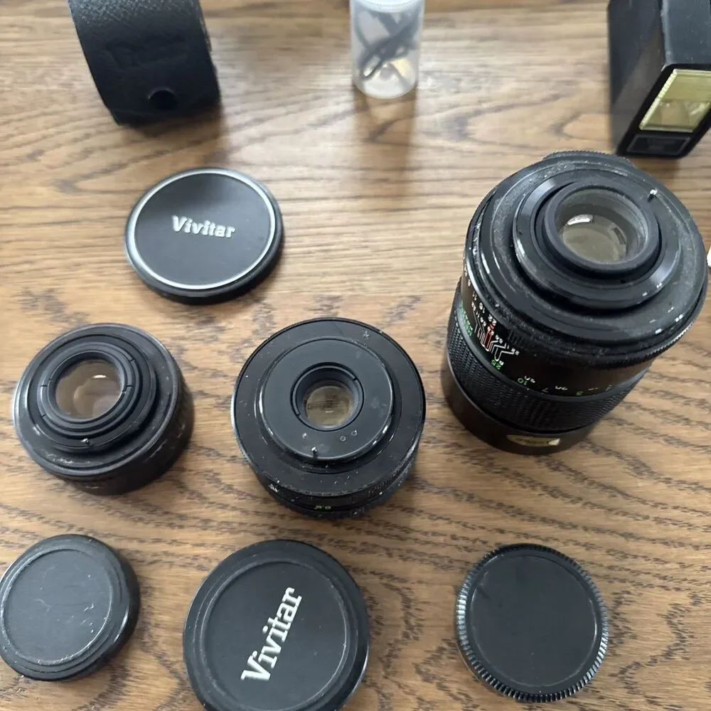 vintage Vivitar hard-sided black camera case And Vivitar camera accessory lot